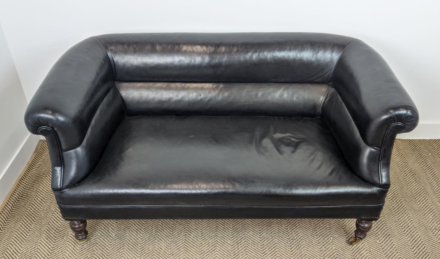 CHESTERFIELD SOFA, Victorian mahogany in black leather on ceramic castors, 76cm H x 157cm x 82cm. - Image 5 of 16