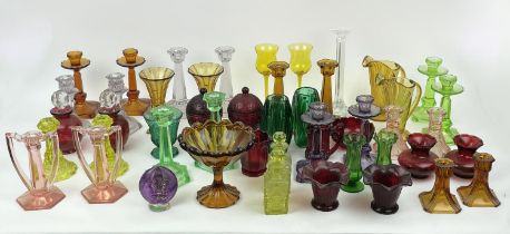 QUANTITY OF URANIUM GLASS, various items including pairs of candlesticks, jugs, lidded vases,
