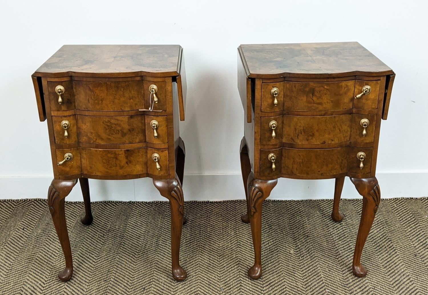 BEDSIDE CHESTS, a pair, Georgian style burr walnut, each with drop flap top above three drawers,