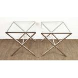 SIDE TABLES, a pair, with glass tops and polished x frame metal bases, each50cm W x 50cm D x 57cm H.