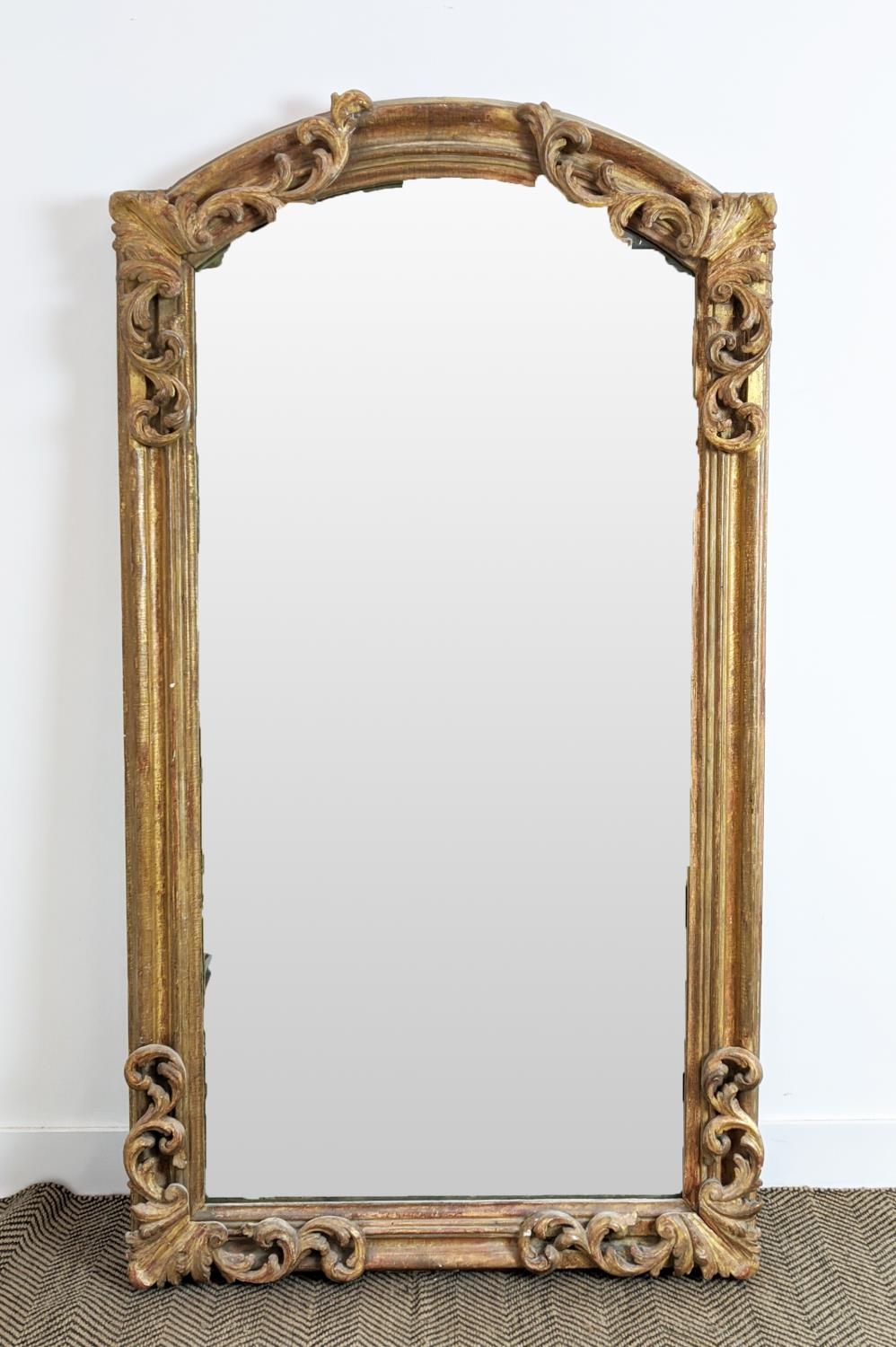 WALL MIRROR, early 19th century Continental giltwood and gesso with arched foliate scrolling frame - Image 4 of 12