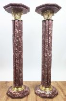 PEDESTALS, a pair, red marble with gilt metal capitols, 100cm H. (2)