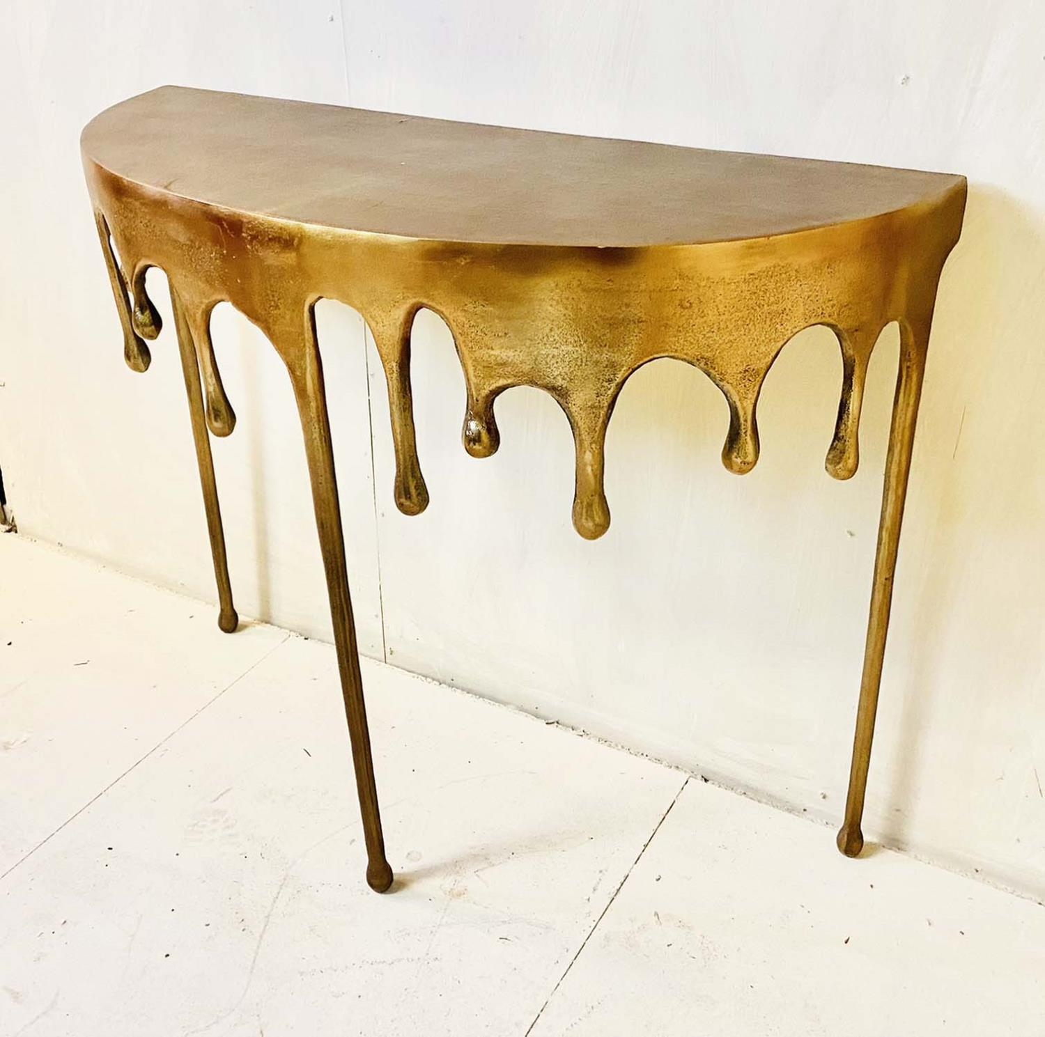 CONSOLE TABLE, dripping design, gilt metal, 76cm x 90cm x 34cm.