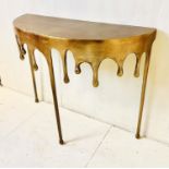 CONSOLE TABLE, dripping design, gilt metal, 76cm x 90cm x 34cm.