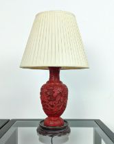 CINNABAR STYLE LACQUER LAMP, early 20th century, carved with a fine claw dragon on a rosewood carved