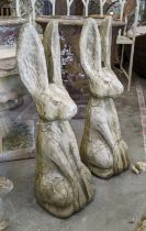 TWO RECONSTITUTED STONE HARES, 68cm H.