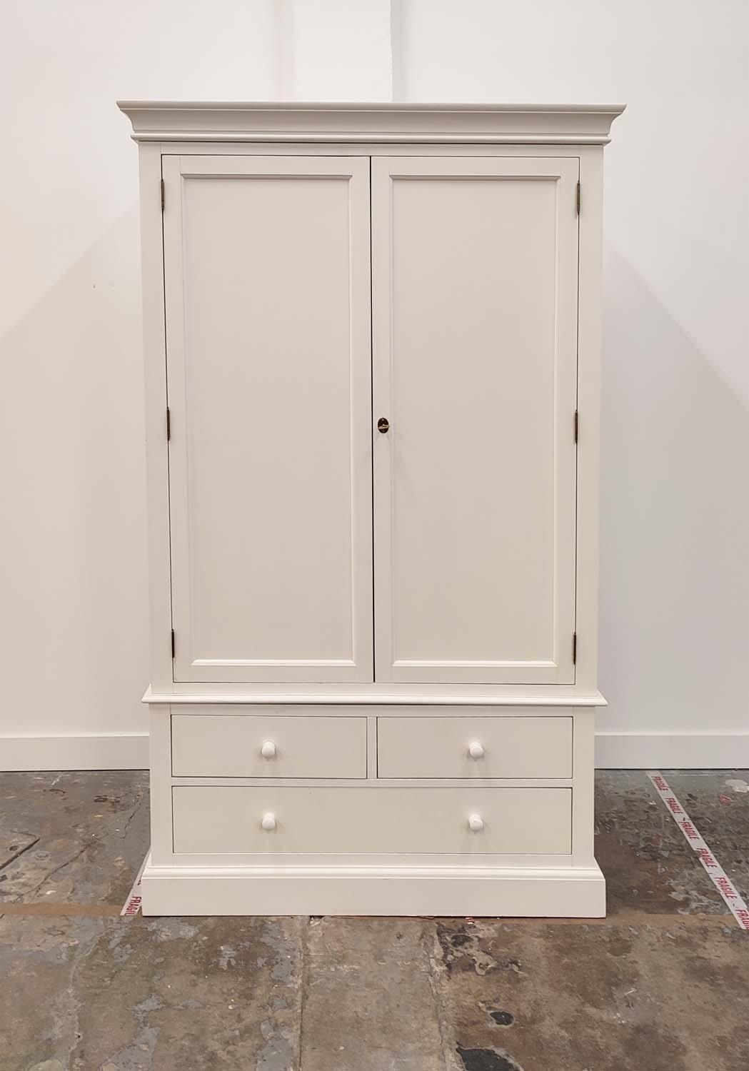 WARDROBE, in a white finish with two doors, hanging rail and three drawers 125cm W x 57cm D x