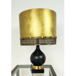 TABLE LAMP, matt black with a brass shade, 51cm x 99cm H.