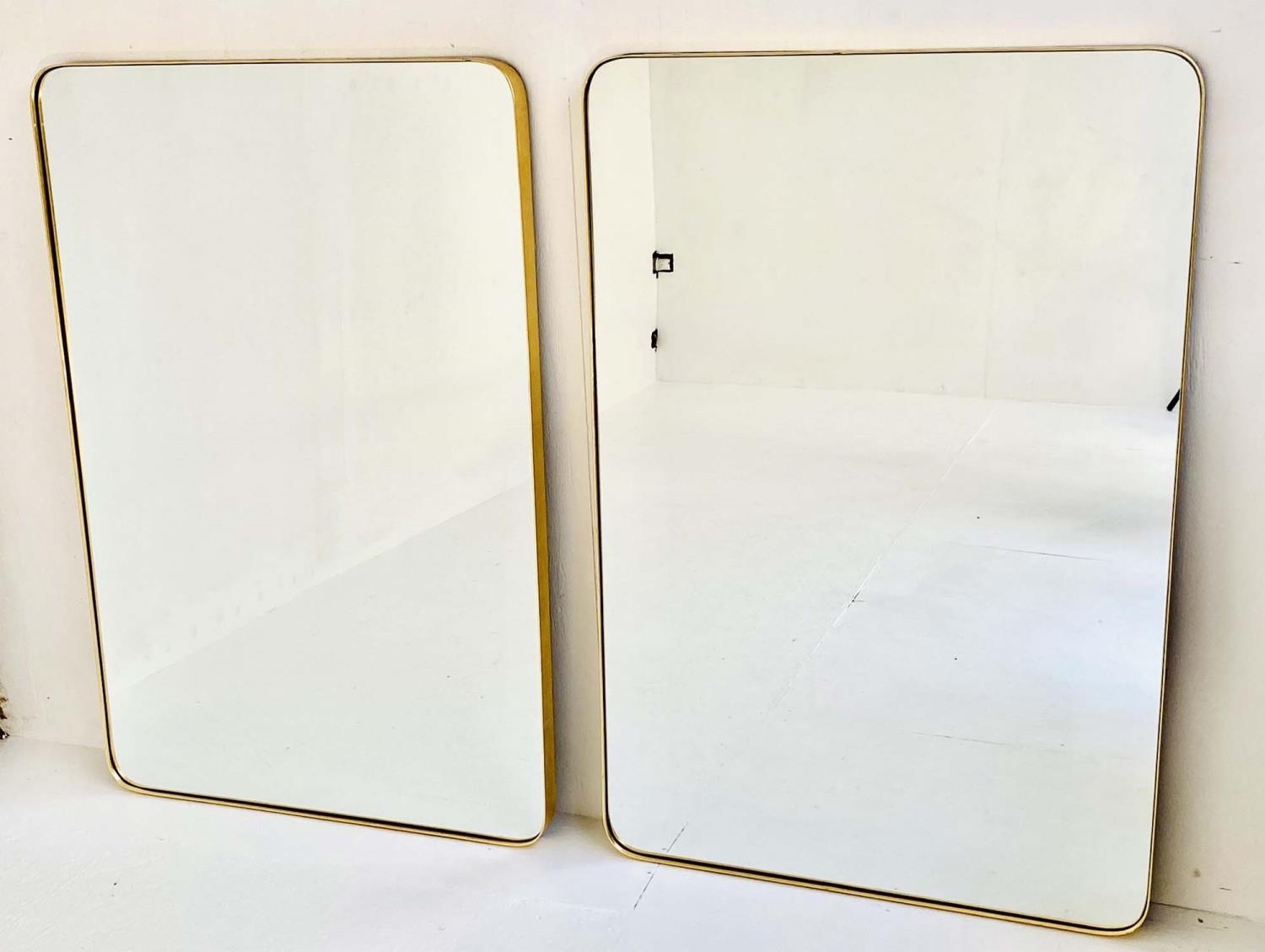 WALL MIRRORS, a pair, 1960s French style, gilt framed, 121cm high x 80cm wide. (2)