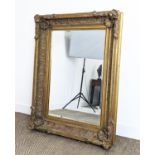 WALL MIRROR, 19th century style gilt framed with shell and leaf decoration, 121cm x 88cm.