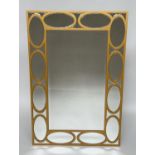 WALL MIRROR, rectangular gilt with oval panelled marginal plates and bevelled mirror throughout,