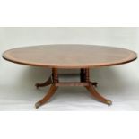 DINING TABLE, circular Regency style radially veneered mahogany and satinwood crossbanded with