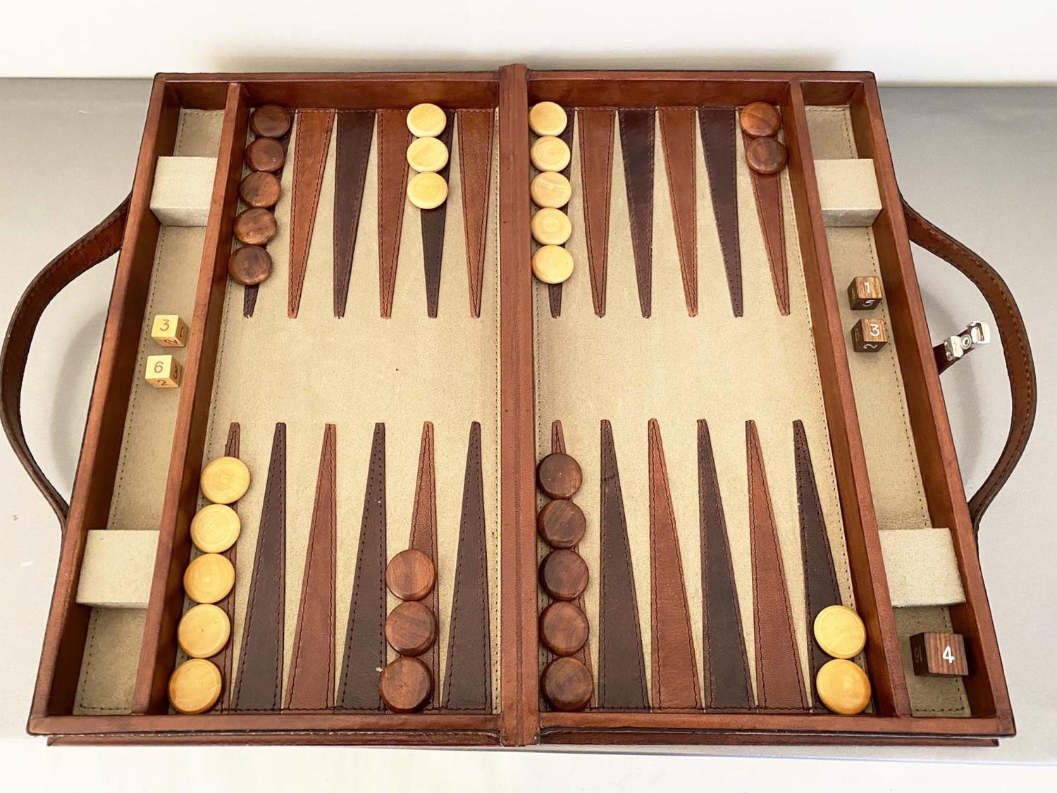 BACKGAMMON SET, in leathered case, complete with counters, 7cm x 23cm x 40cm.