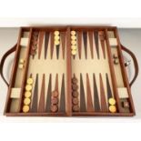 BACKGAMMON SET, in leathered case, complete with counters, 7cm x 23cm x 40cm.