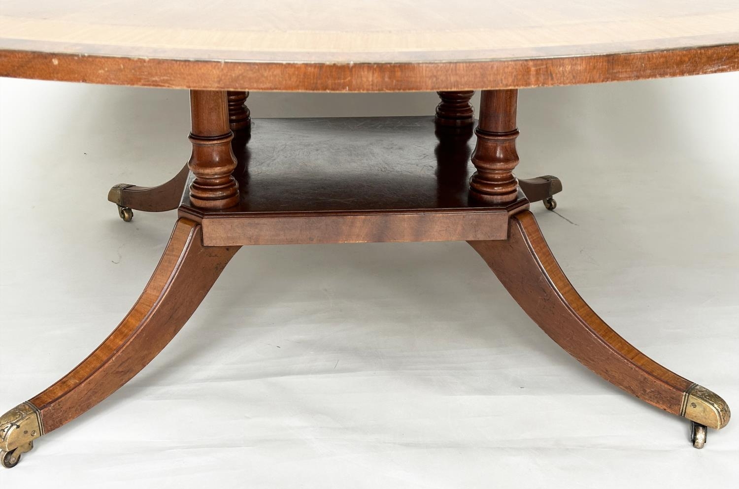 DINING TABLE, circular Regency style radially veneered mahogany and satinwood crossbanded with - Image 7 of 17