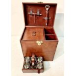 DRINKS CASE, leathered, containing six cups, ice bucket and tongs, etc. 32cm H x 32cm W x 23cm D