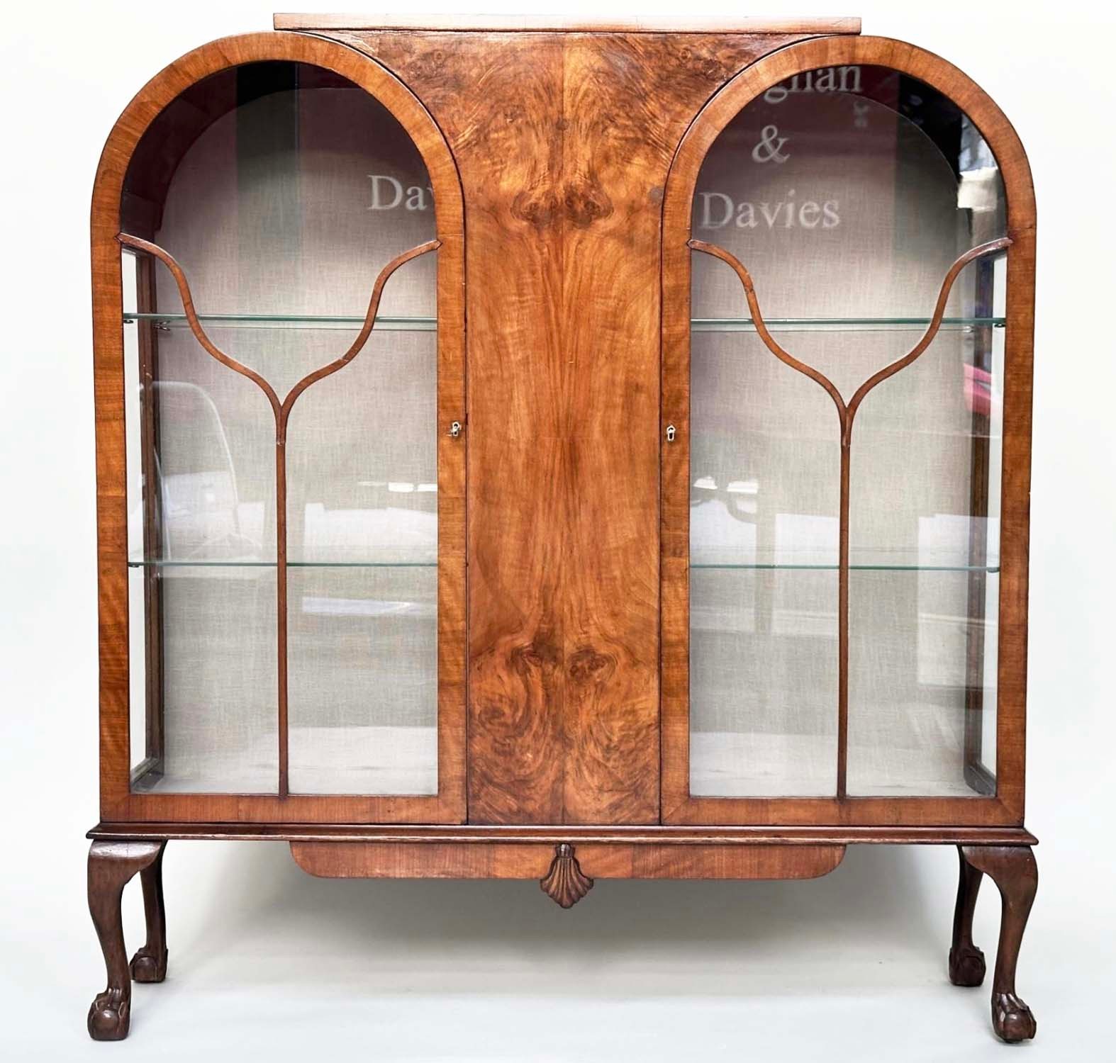 ART DECO DISPLAY CASE, burr walnut with two arched glazed doors enclosing shelves, 117cm W x 128cm H