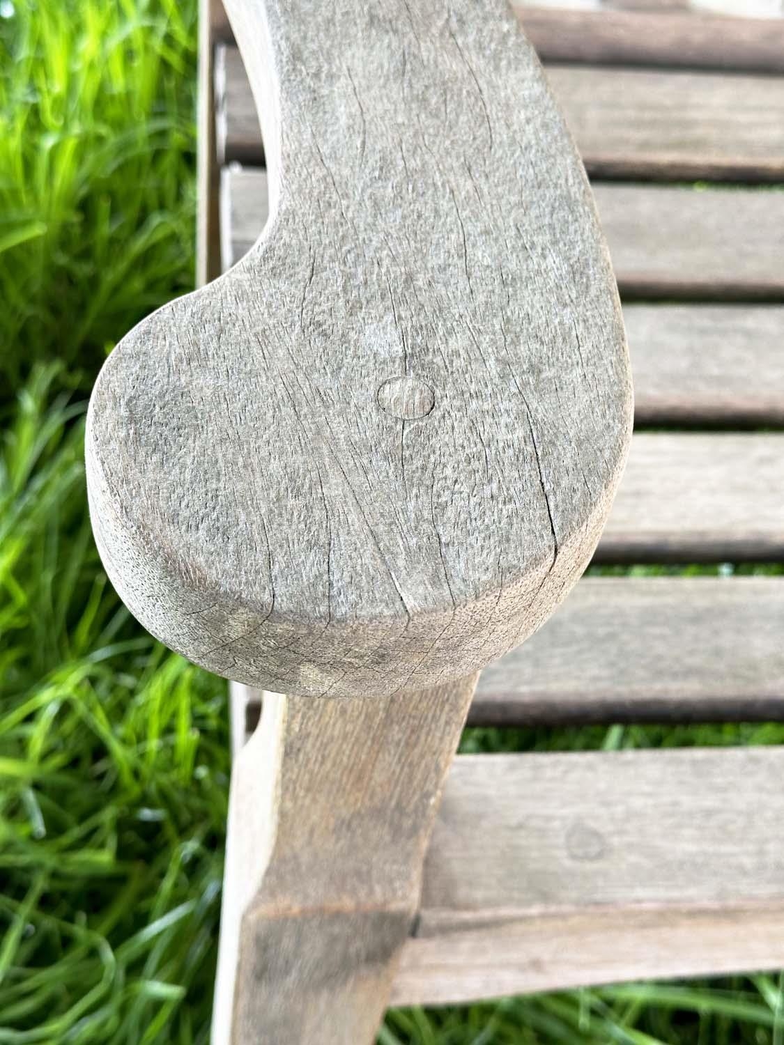 GARDEN BENCH BY 'BRIDGMAN AND CO', well weathered teak slatted with shaped yoke and shaped flat - Image 7 of 18