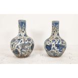 BOTTLE VASES, a pair, Chinese style blue and white ceramic, 60cm H x 38cm W. (2)