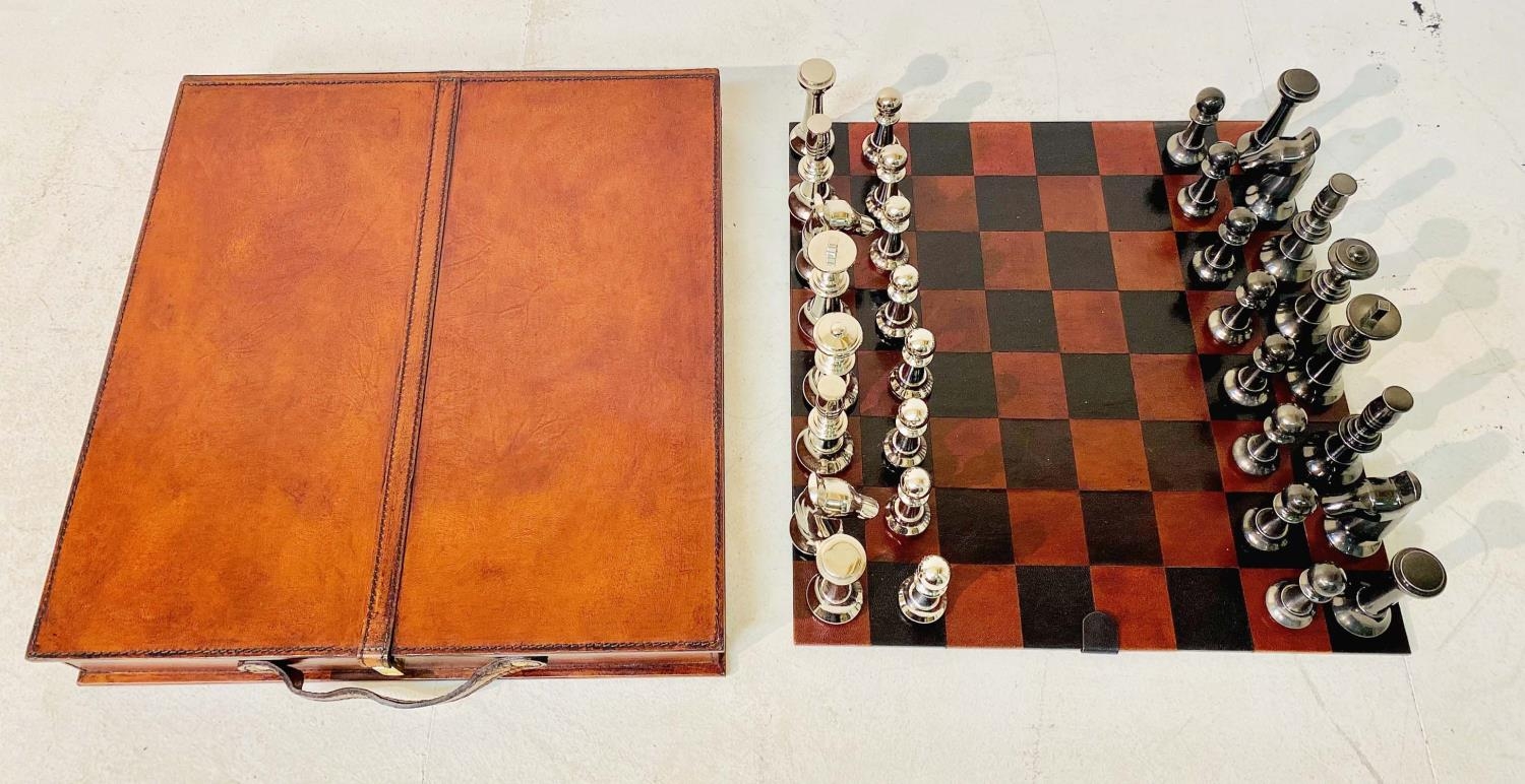 CHESS SET, IN LEATHERED CASE, 7cm x 43cm x 41cm.