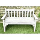 GARDEN BENCH, silvery weathered teak of slatted construction, 130cm W, by 'Lister'.