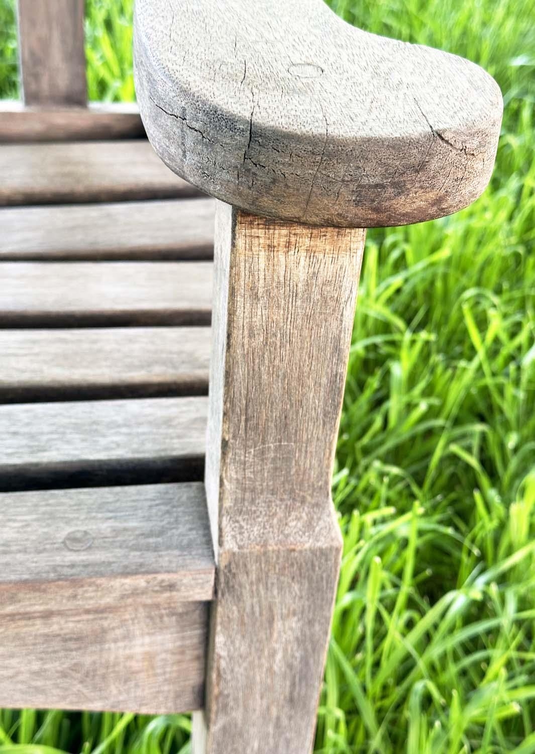 GARDEN BENCH BY 'BRIDGMAN AND CO', well weathered teak slatted with shaped yoke and shaped flat - Image 10 of 18