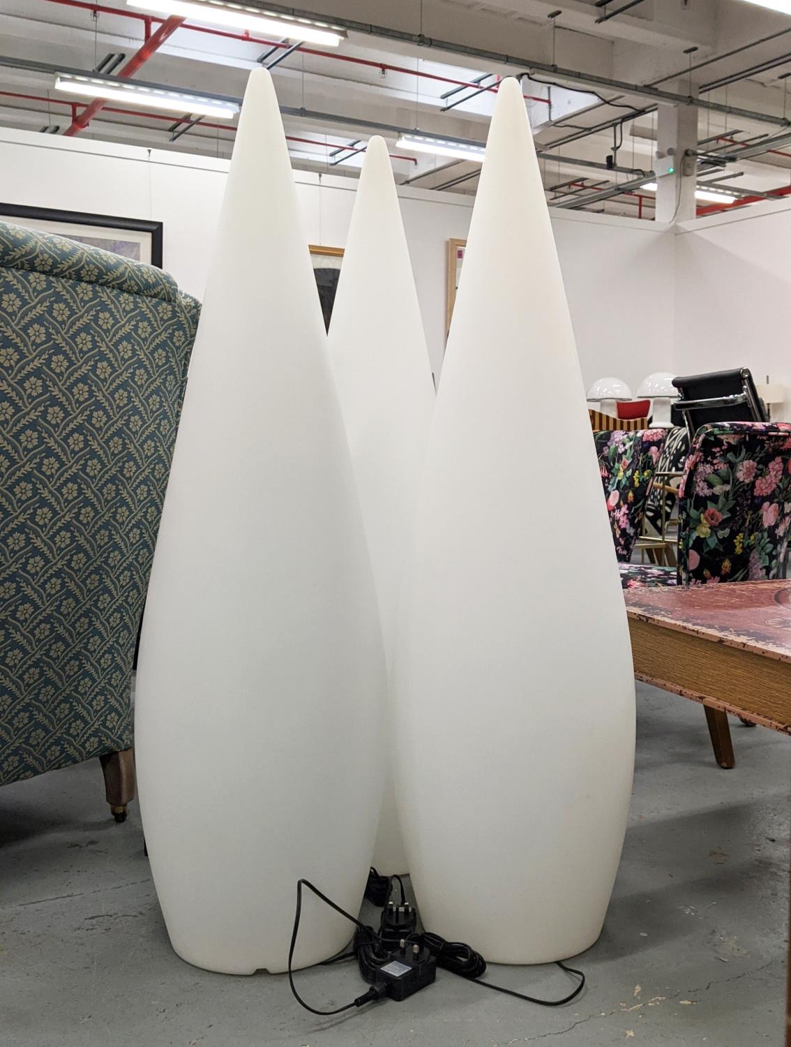 SKYLINE FLOOR LIGHTS, a set of three opaque resin cones, each 122cm tall.