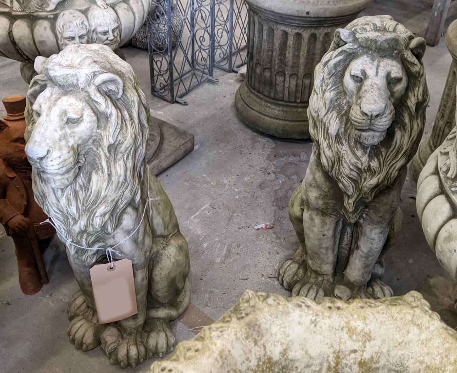 TWO RECONSTITUTED STONE LIONS, 58cm H.