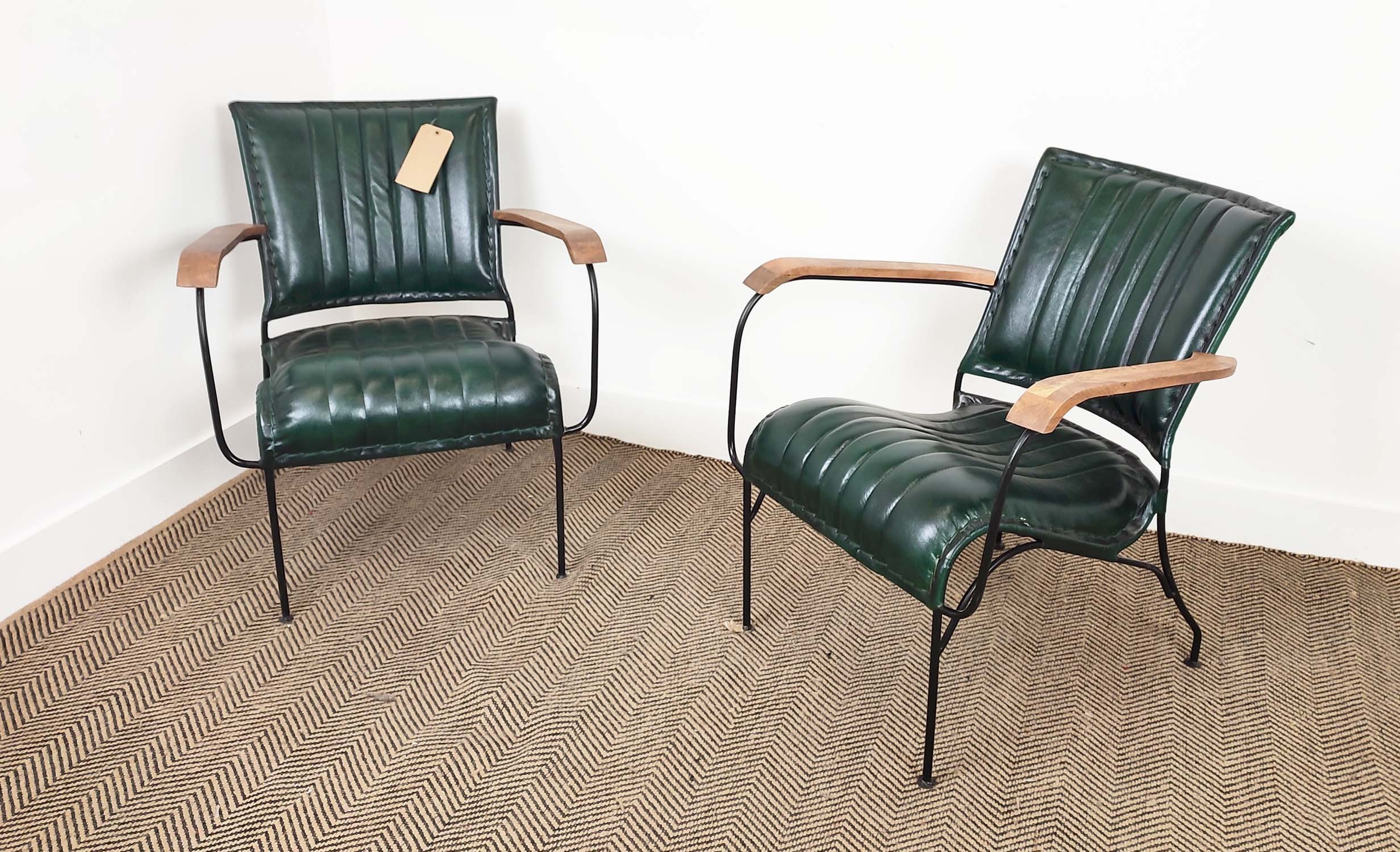 ARMCHAIRS, a pair, green leather upholstery with wooden arms and metal supports, 65cm x 75cm H x