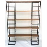 SHELVING RACK BY 'HEALS', comprising two metal towers with five walnut shelves, 150cm W x 32cm D x