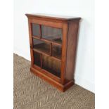 DWARF BOOKCASE, late Victorian walnut with bevelled glazed panel door enclosing shelves, 81cm H x