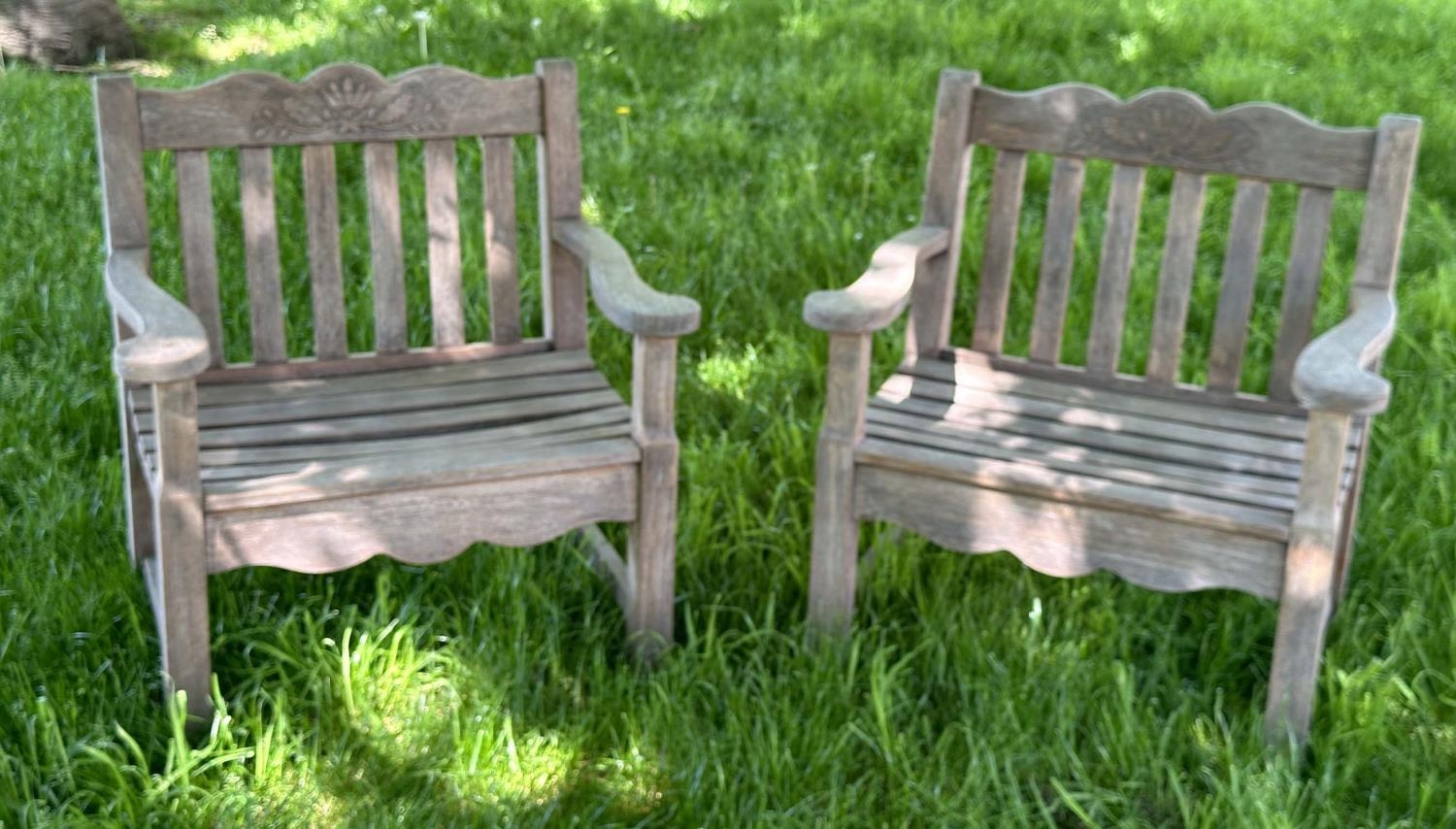 GARDEN ARMCHAIRS BY BRIDGMAN & CO LTD, a pair, well weathered teak with generous seats, slatted