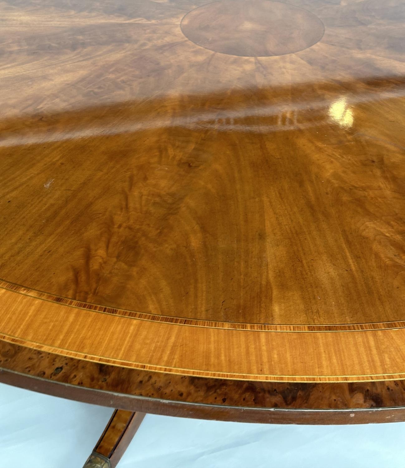 DINING TABLE, circular Regency style radially veneered mahogany and satinwood crossbanded with - Image 5 of 17