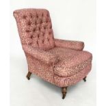 HOWARD STYLE ARMCHAIR, with button back, scroll arms, feather cushion and turned front supports