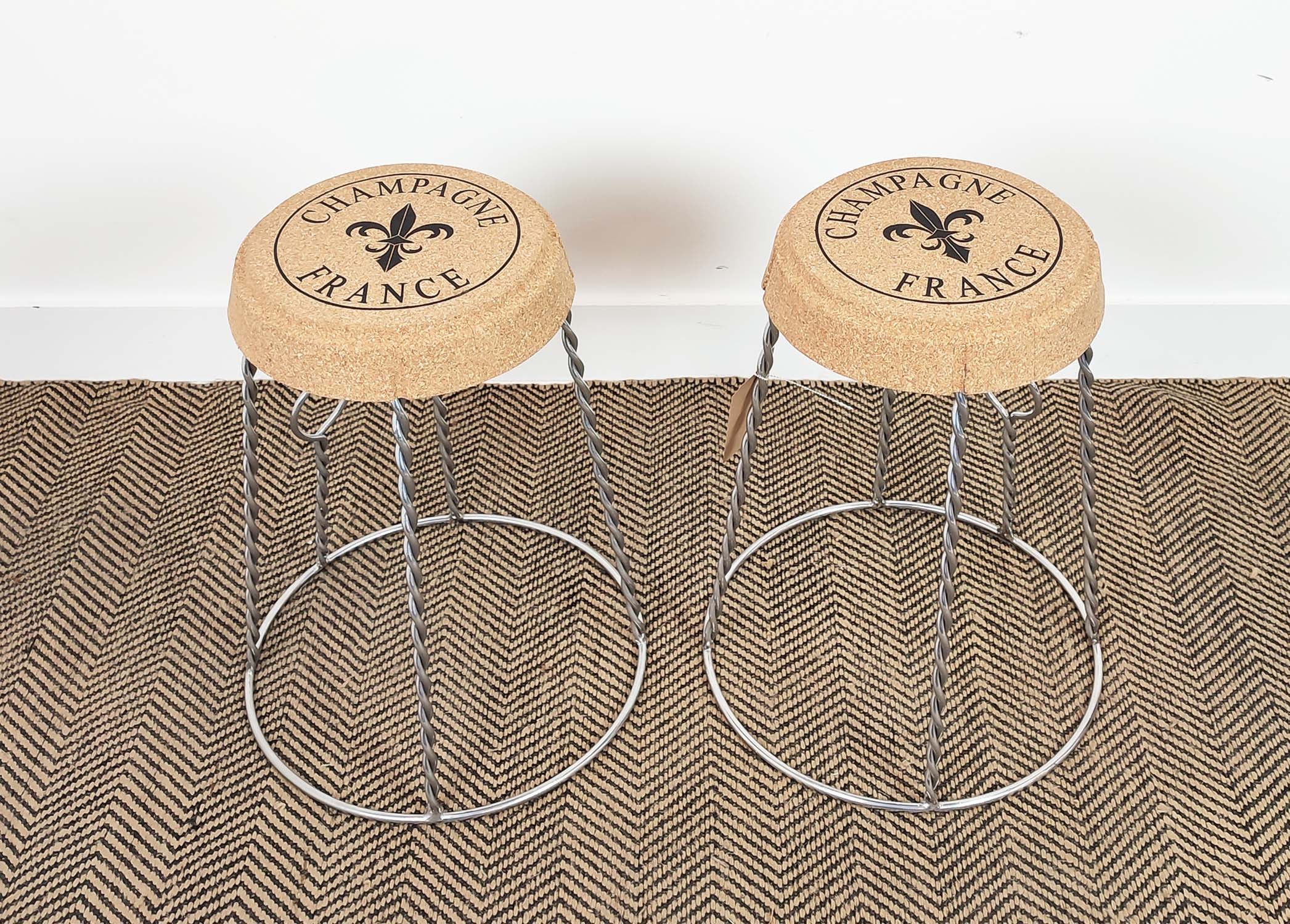 CHAMPAGNE CORK STOOLS, a pair, vintage style with twisted metal bases, 53cm H. (2)