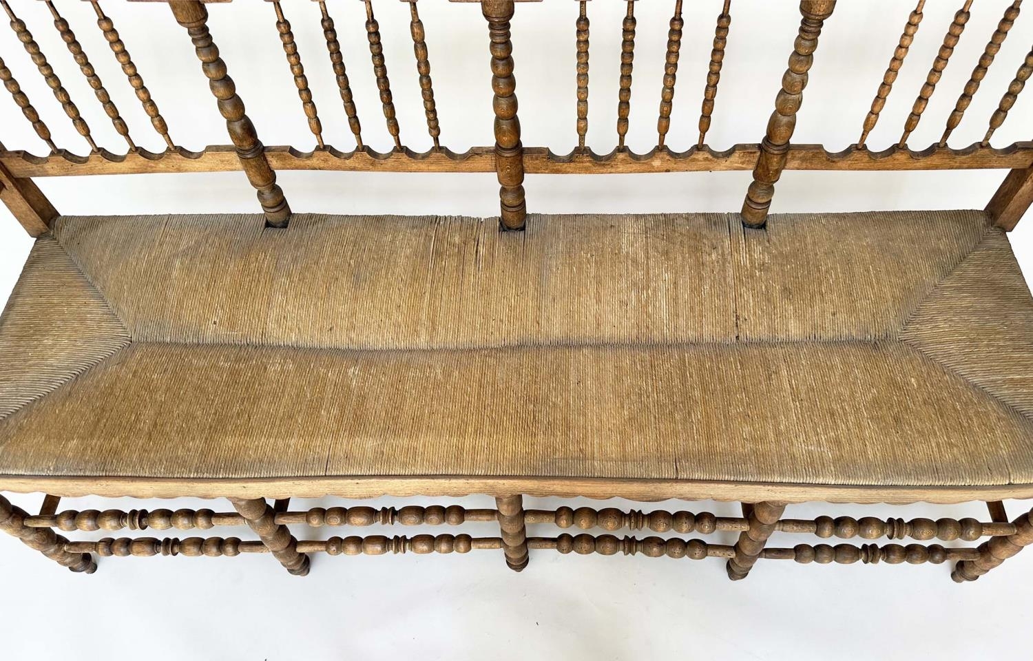 HALL SEAT, 19th century English, William Morris style fruitwood with bobbin turned frame and rush - Image 7 of 11