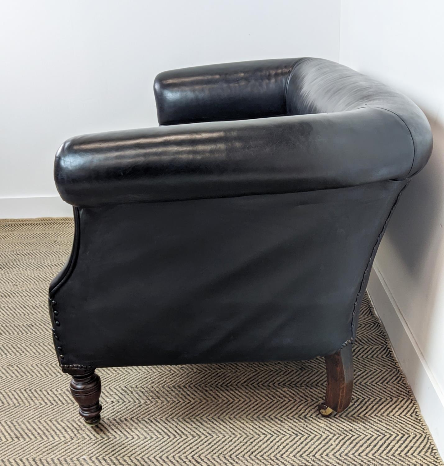 CHESTERFIELD SOFA, Victorian mahogany in black leather on ceramic castors, 76cm H x 157cm x 82cm. - Image 10 of 16