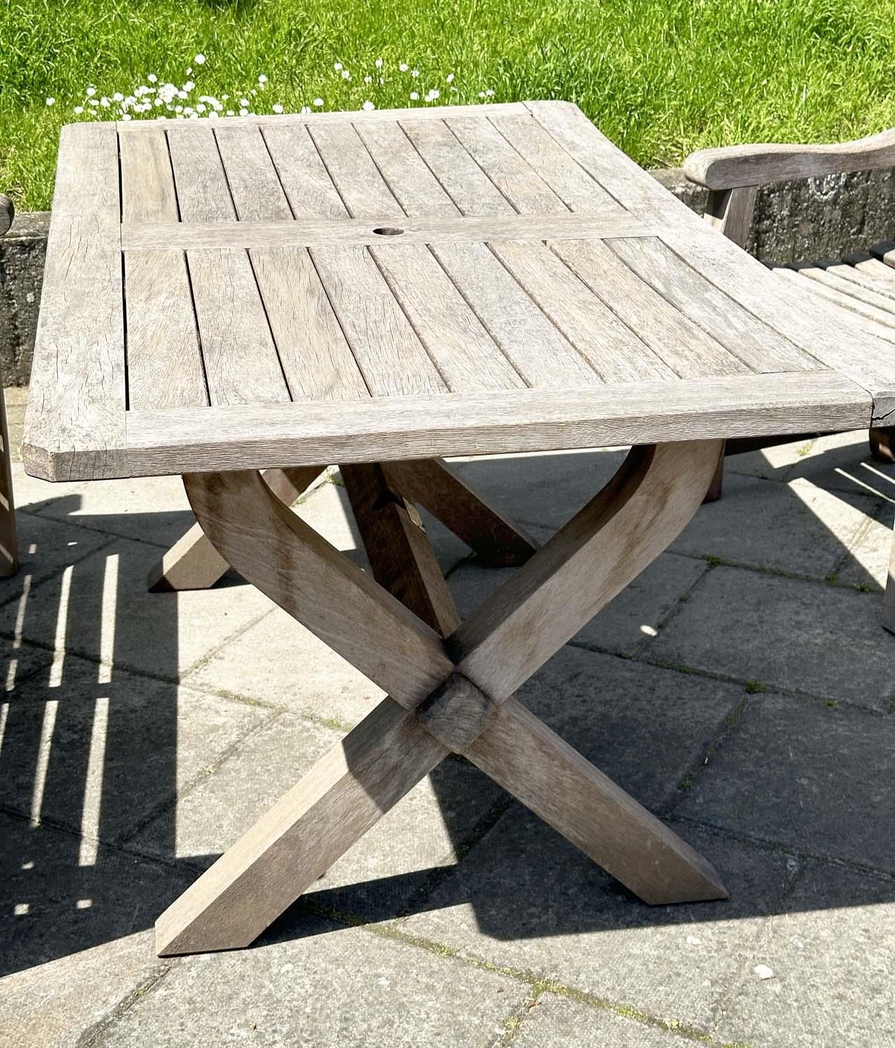 GARDEN SET BY WOODFERN, well weathered teak with substantial X frame table, 72cm H x 152cm W x - Image 15 of 22