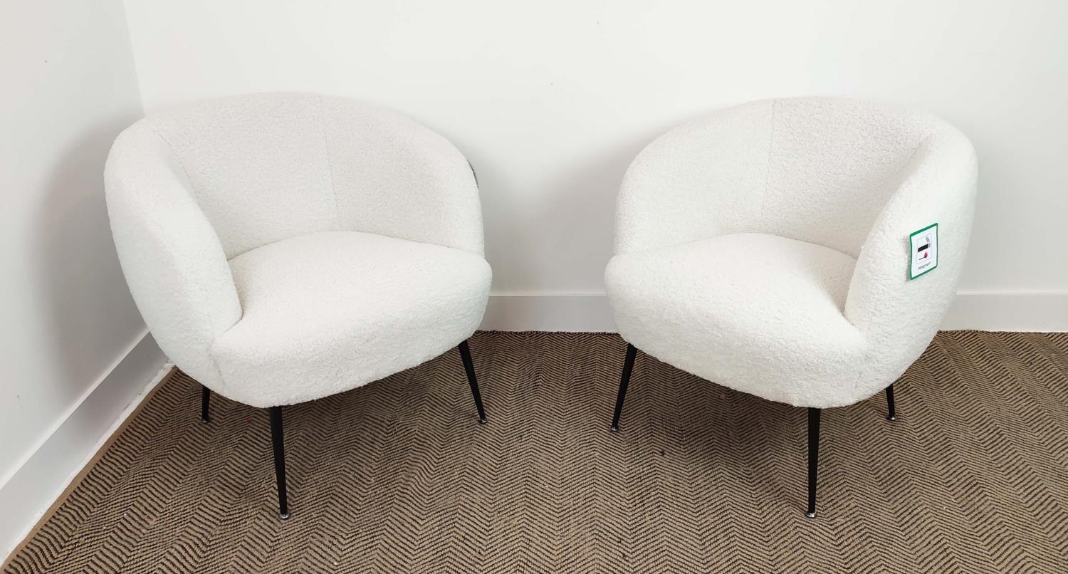 TUB CHAIRS, a pair in boucle wool on black metal legs, 74cm H x 74cm W x 70cm D. (2)