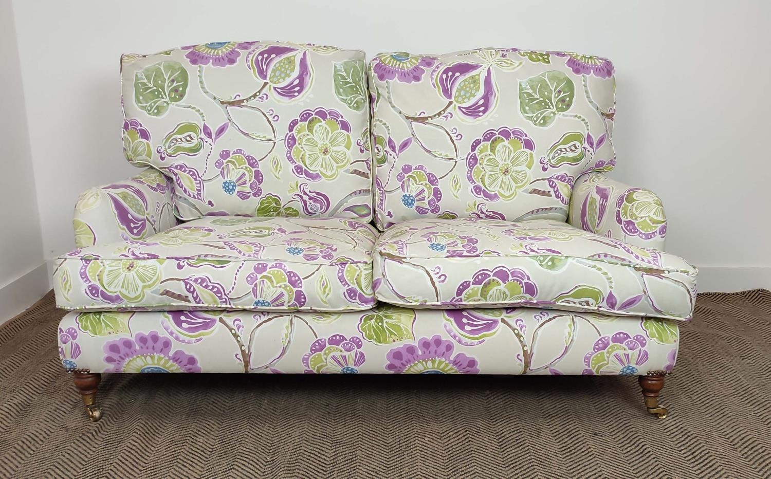 SOFA, purple and green floral patterned on brass castors, 90cm H x 160cm W. - Image 3 of 14