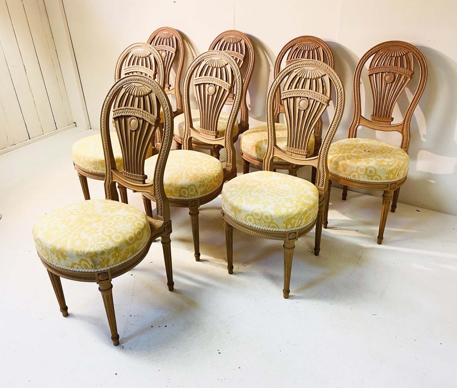 DINING CHAIRS, a set of eight, Louis XVI style balloon backed in beechwood with upholstered seats,