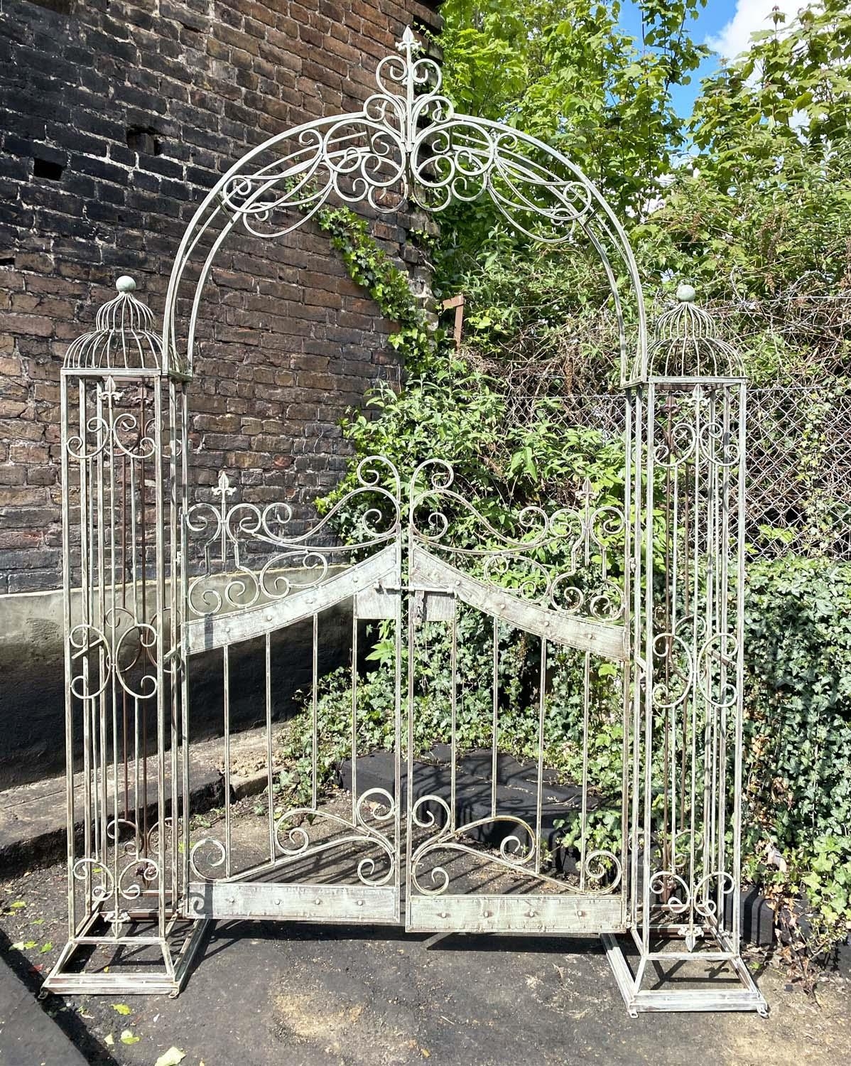 ARCHITECTURAL GARDEN GATE, Regency style, distressed metal frame, 250cm high, 185cm wide, 38cm deep.