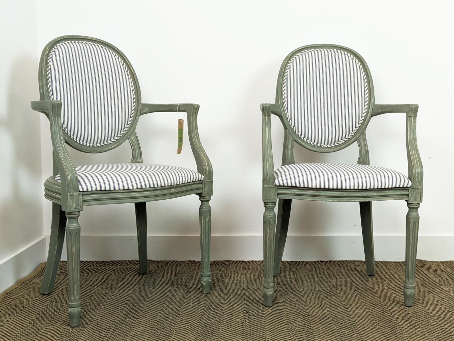 A PAIR OF LOUIS XVI STYLE FAUTEUILS, blue and grey pin stripe fabric, grey distressed finish to