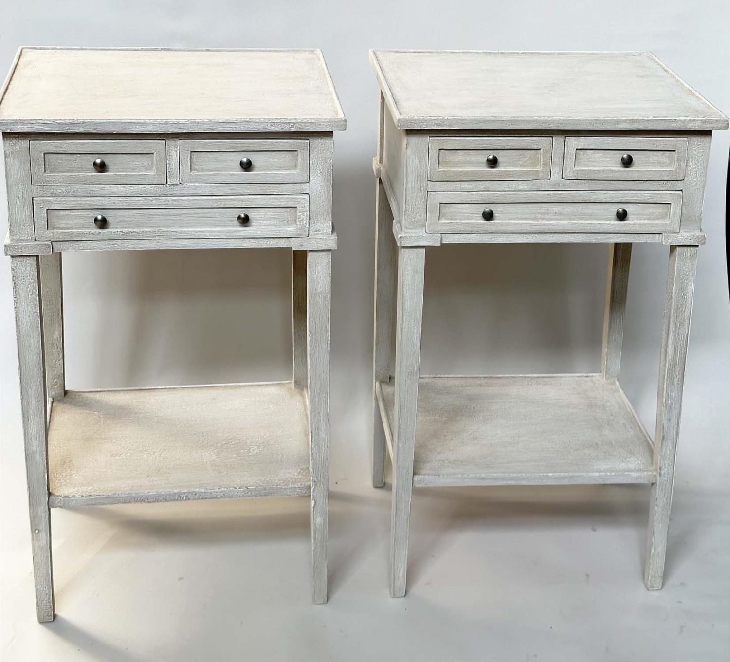 BEDSIDE/LAMP TABLES, a pair, French style grey painted each with three drawers and undertier, 44cm W