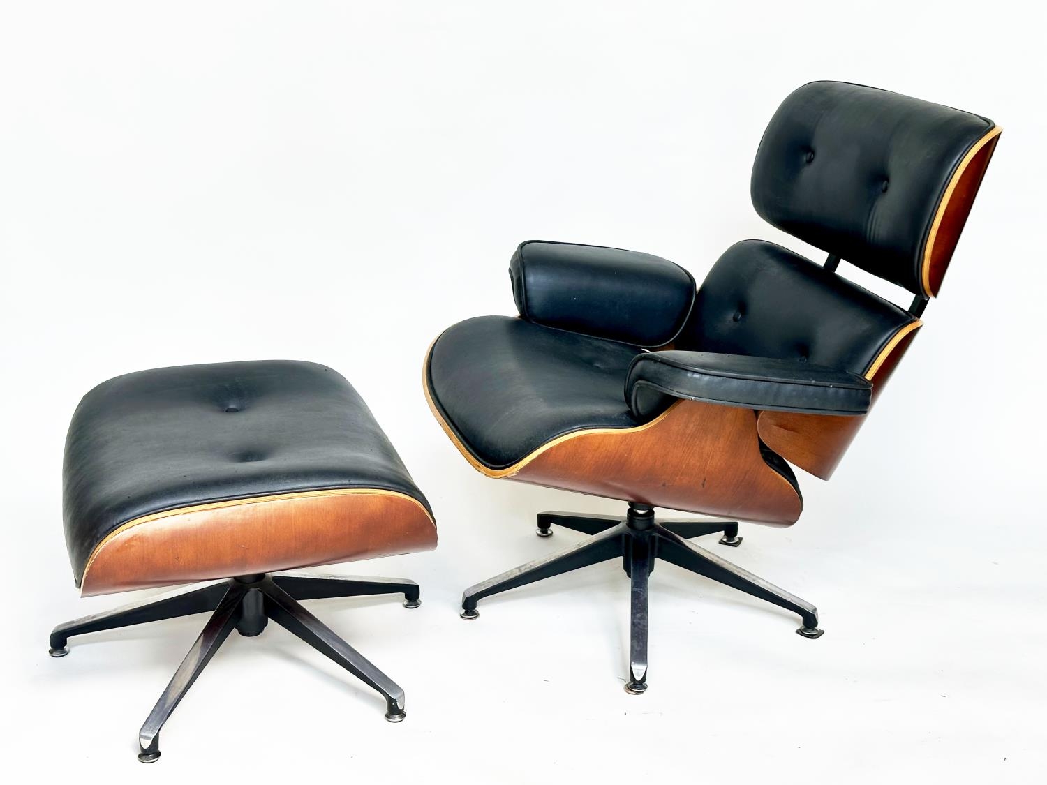 LOUNGER AND OTTOMAN AFTER CHARLES AND RAY EAMES, 81cm W.