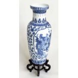 PEACOCK VASE ON STAND, large Chinese ceramic blue and white peacock vase on carved wood stand,