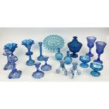 QUANTITY OF BLUE URANIUM GLASS, comprising four pairs of candlesticks, two pairs of icecream