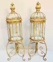 STORM LANTERNS ON STANDS, 115cm H x 34cm diam., Regency style, gilt metal frames. (2)