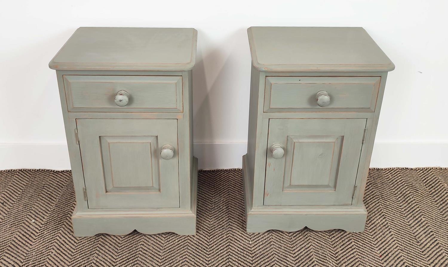 BEDSIDE CABINETS, a pair, grey painted, each with drawer and door, 60cm H x 40cm x 36cm. (2)