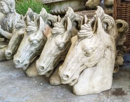 COMPOSITE STONE HORSE HEAD BUSTS, a set of four, 40cm H. (4)
